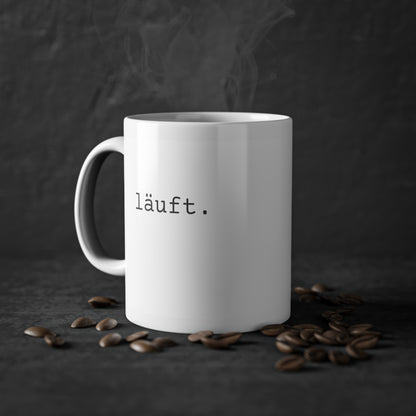 Weisse Design Tasse "läuft."